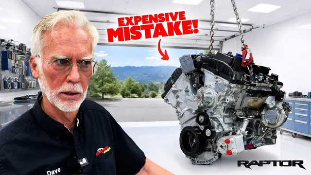Dave Bell beside a Ford Raptor engine hanging from a hoist, "Expensive mistake!"