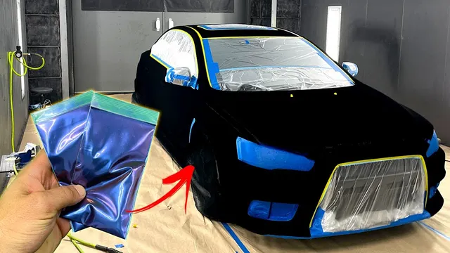 Hand holding a HyperShift pigment bag next to a car sprayed in Musou Black