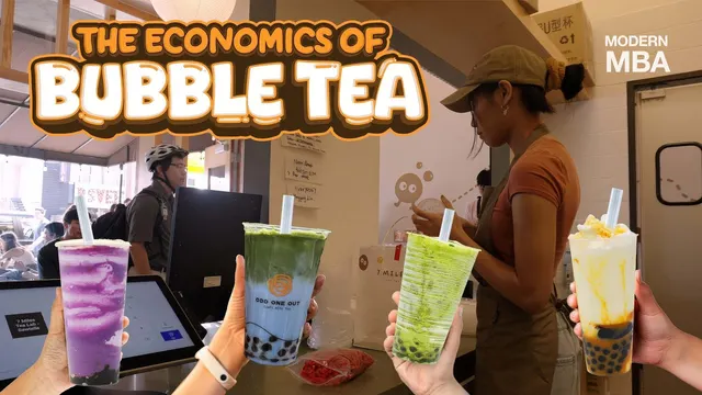 Hands holding colourful bubble tea cups at a shop counter
