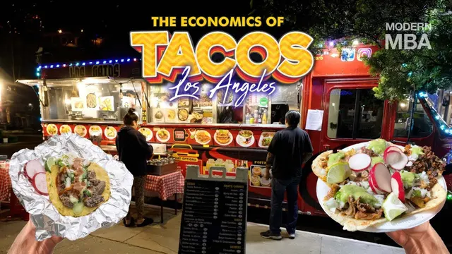 Tacos in front of a lit-up Los Angeles taco truck at night