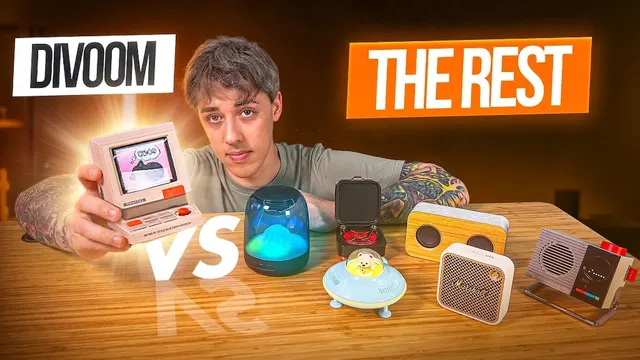 NoodleNick holding a Divoom Minitoo speaker beside rival speakers, "Divoom vs The Rest"